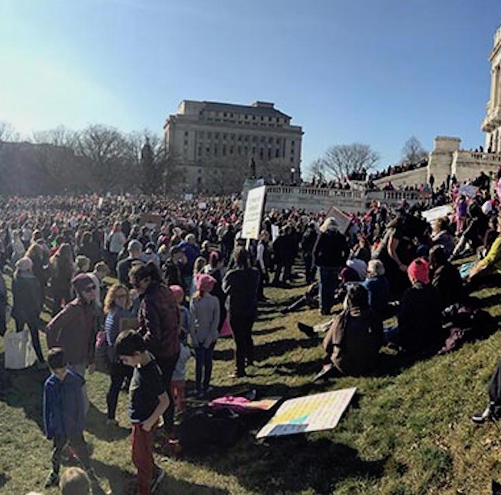 Protest on a lawn in front of a building