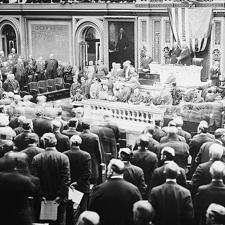 Congress chamber filled with standing men