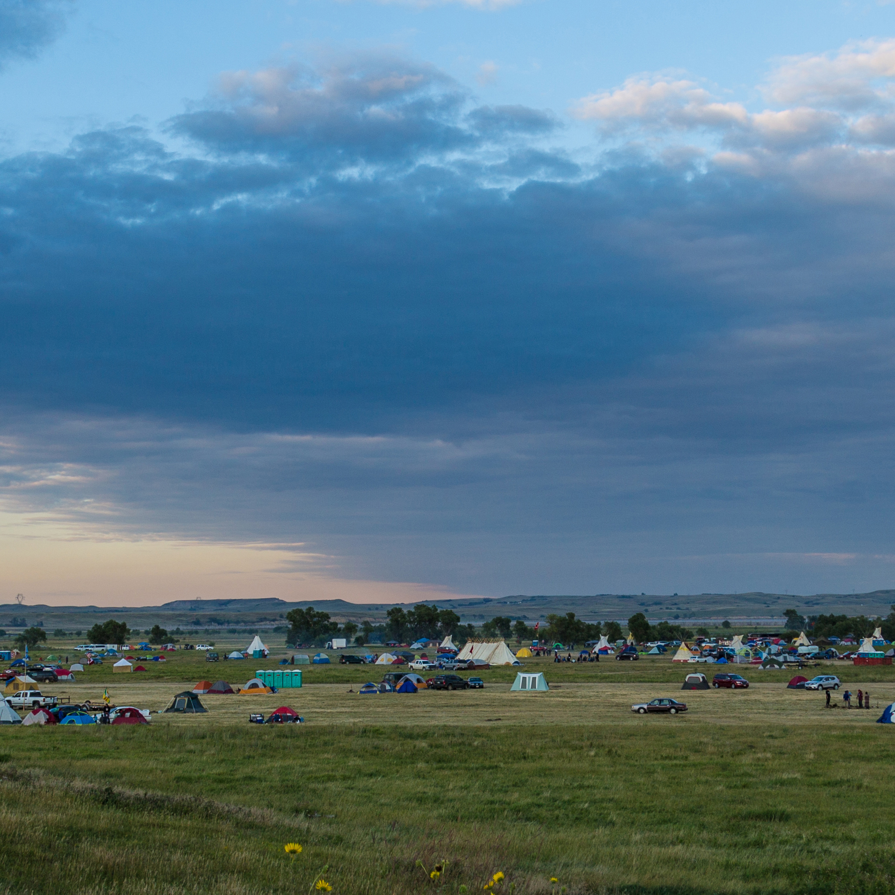 Groups of tents on a grass plain