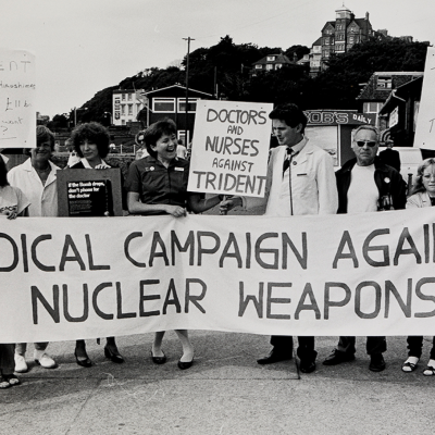 Protestors holding a banner that says 
