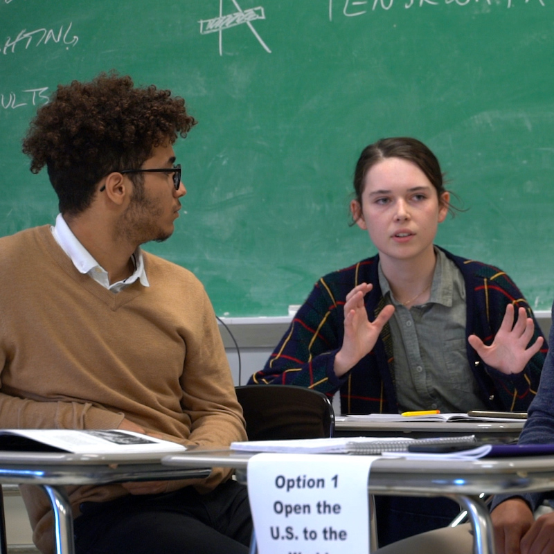 Students discussing a Choices activity in a small group