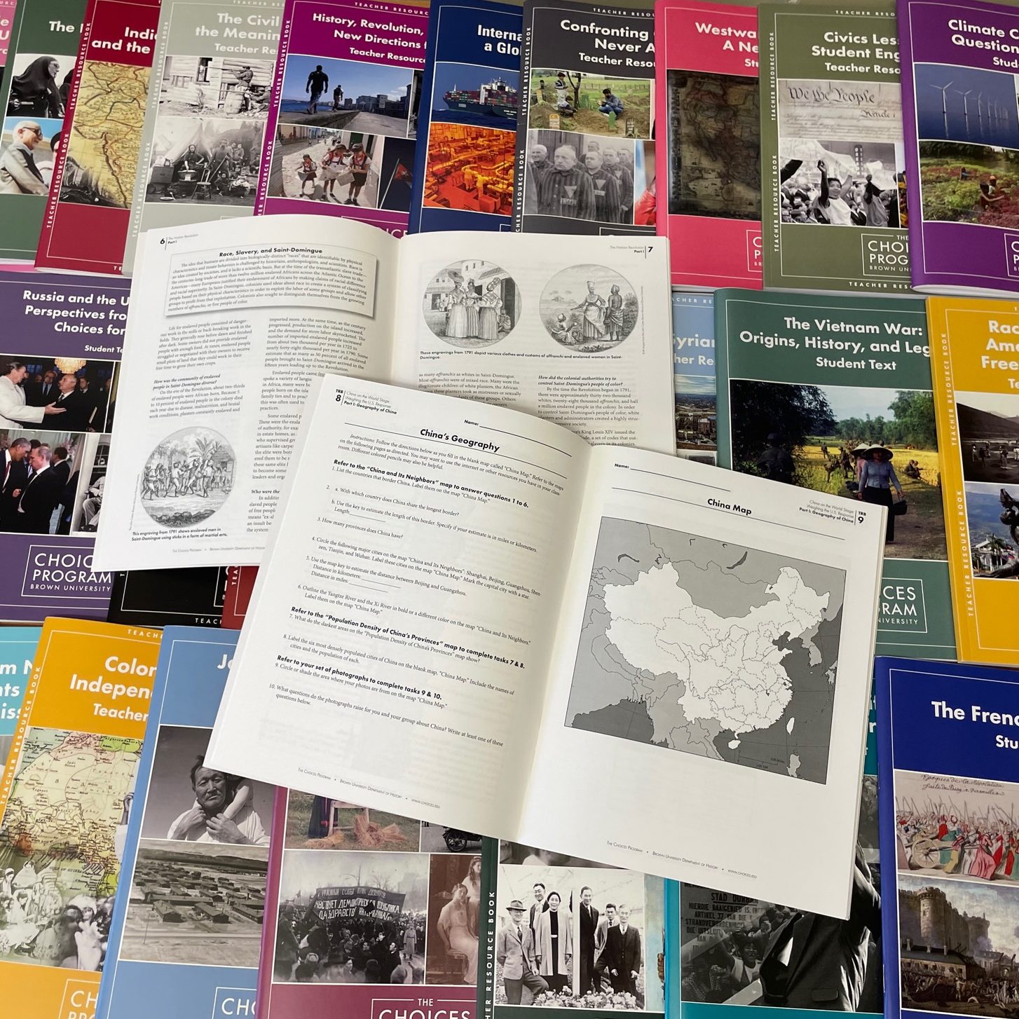 Image of Choices curriculum units with brightly colored covers and two units laid open, one with a map of China.